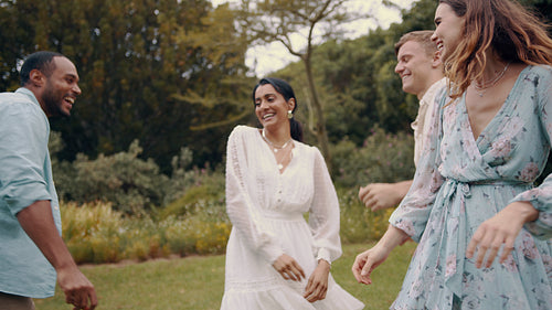 Friends enjoying dancing at the park