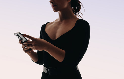 Young woman browsing social media on a modern smartphone