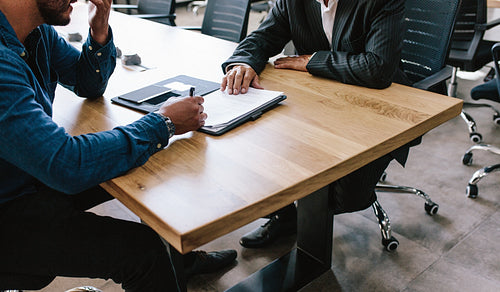 Business men signing a deal