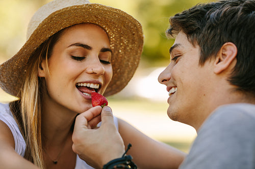 Romantic couple on picnic sitting in park