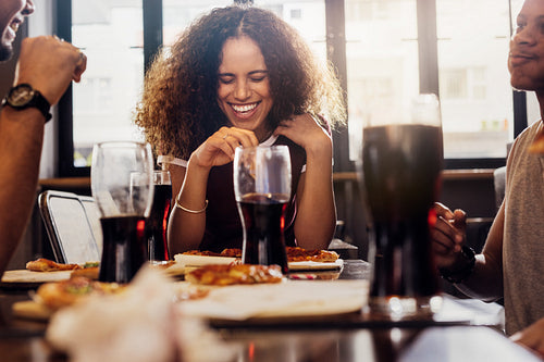Woman enjoying lunch with friends at cafe