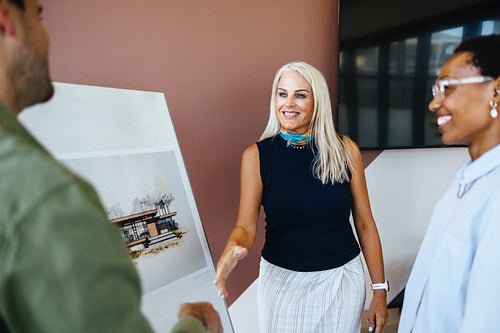 Business professionals meeting and discussing architectural project with collaboration