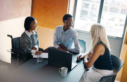 Diverse group of professionals collaborating in a modern workplace setting