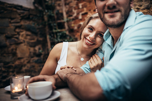 Romantic couple on a date sitting in a restaurant
