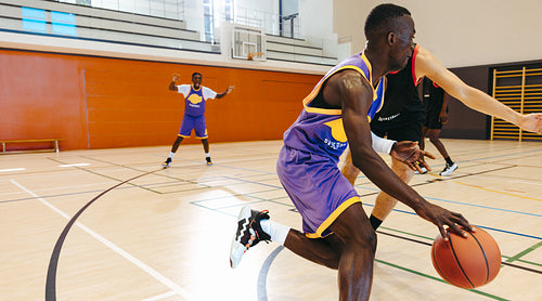 Basketball players competing in a game