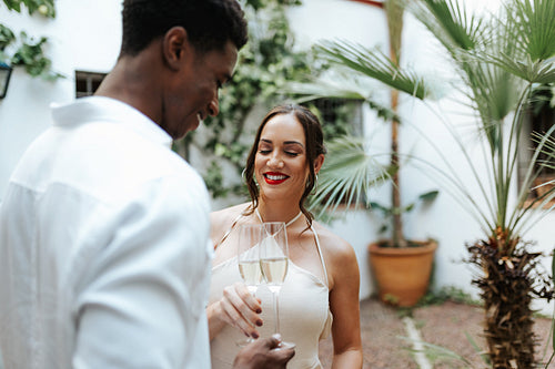 Happy young couple making a toast with sparkling wine