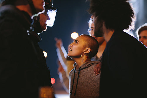 Angry protestors protesting in front of police force