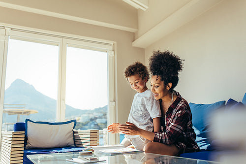 Woman reading a story book for her child