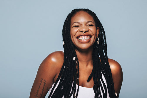 Black woman smiling in a studio