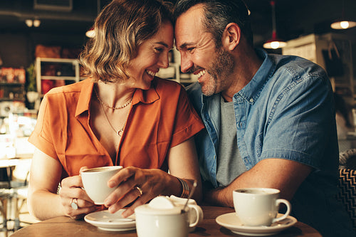 Loving couple of a date at coffee shop