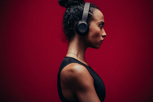 Fitness woman in sportswear and headphones