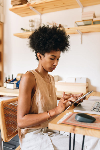 Jewelry designer working on phone