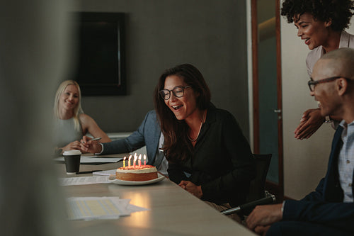 Surprise birthday celebration of a female associate in office