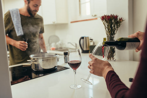 Couple making dinner arrangements at home