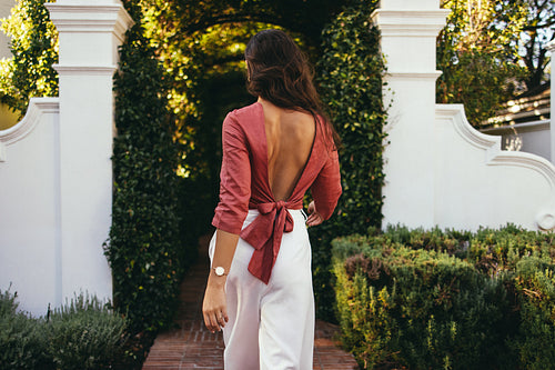 Young tourist woman walking alone outdoors