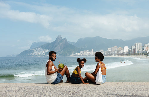 Happy family enjoying a sunny day on Ipanema Beach in Rio de Janeiro