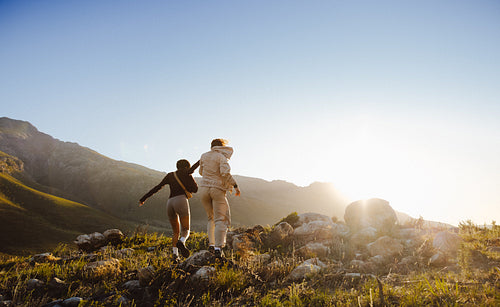 Hiking together through sunny mountains