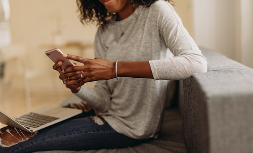 Businesswoman working from home on laptop