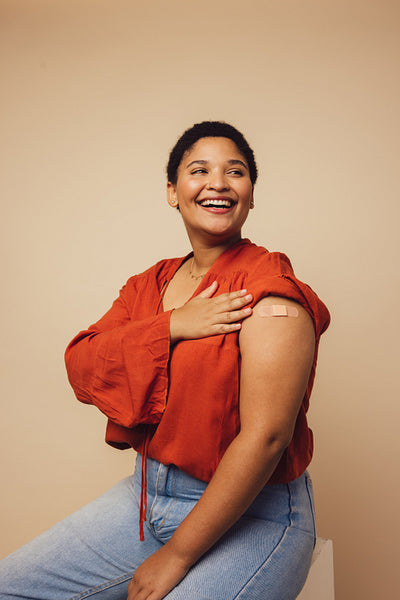 Woman smiling after getting covid-19 vaccine