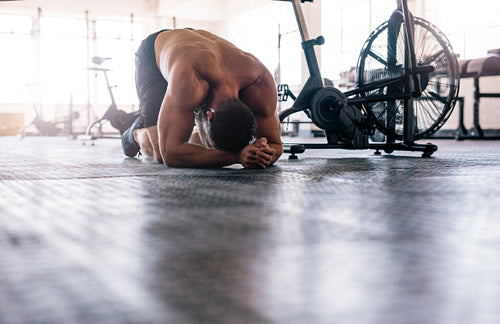 Muscular man taking break after crossing training