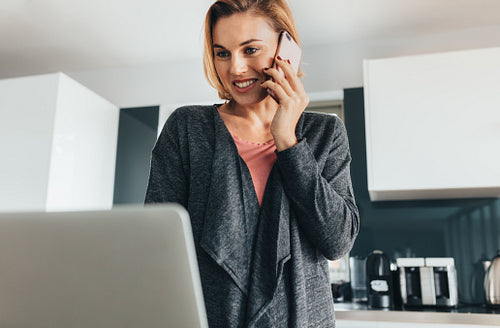 Woman managing office work from her home