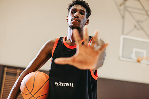 Game face: Basketball player poses in warm-up gear