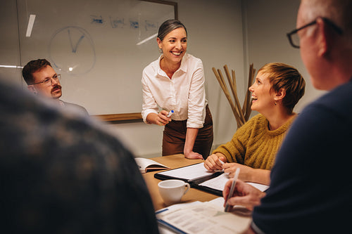 Woman leading boardroom meeting