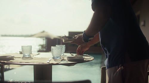 Preparing a beautiful breakfast spread for a family vacation at an island resort