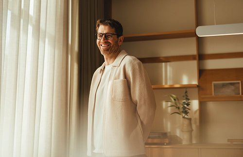 Businessman in contemporary Scandinavian office workspace