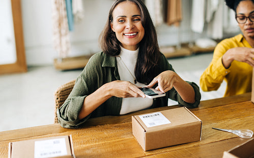 Dropshipping business: Female entrepreneur fulfilling orders for her online store