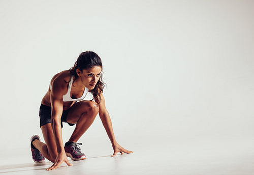 Focused woman ready for a run
