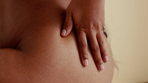 Woman connects with her body through self care