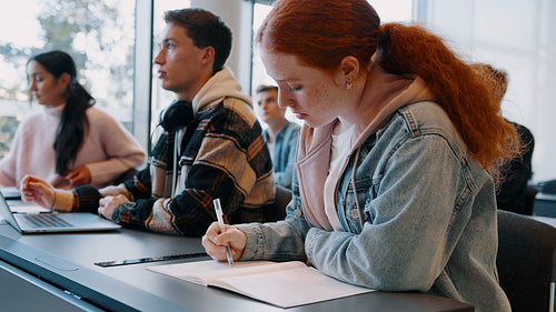 College students engaging with the professor in a lecture