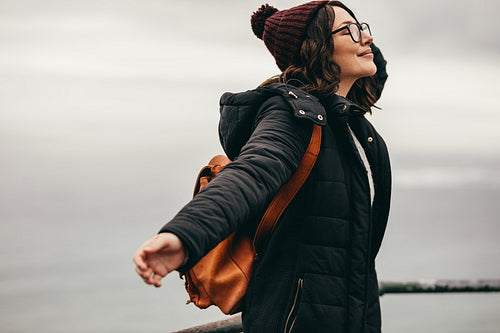 Young woman breathing fresh air at the hill top