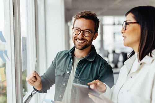 Business man brainstorming with his colleague in an office