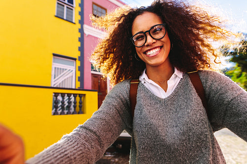 African girl traveler taking selfie outdoors