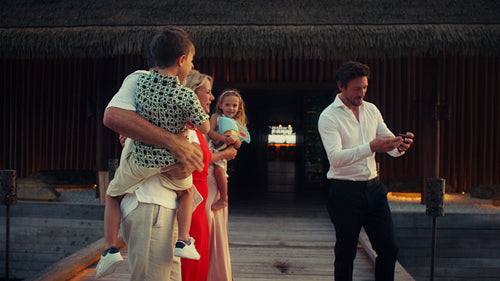 A teppanyaki chef prepares a delicious meal for a couple at a luxury restaurant during sunset