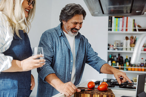 Senior couple cook healthy food with a tablet at home
