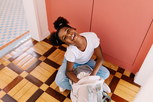 Happy afro girl's daily routine: Preparing for school