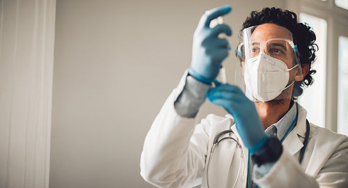 Healthcare worker preparing vaccine injection
