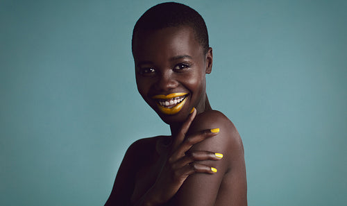 Stylish african woman with metalic makeup