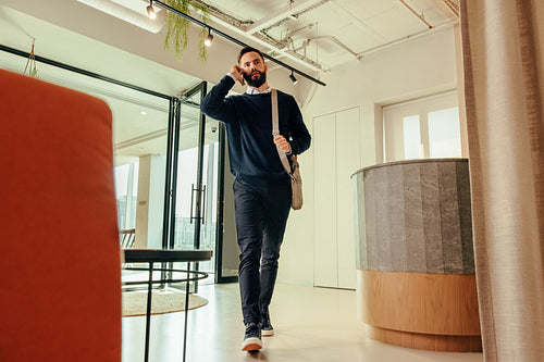 Businessman speaking on the phone in an office