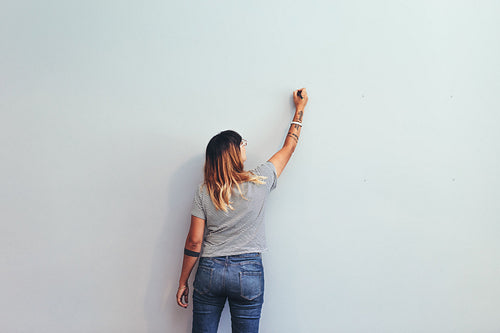 Artist making a sketch on a wall