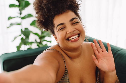 Woman taking selfie and smiling
