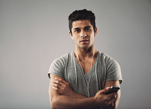 Hispanic guy enjoying listening to music