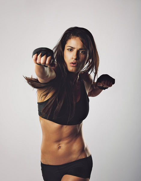 Female boxer boxing punch towards camera
