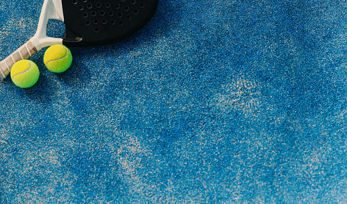 Padel tennis court with racket and padel balls