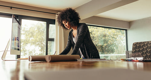 Female architect working at home office