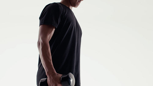 Man lifting dumbbells for strength training workout
