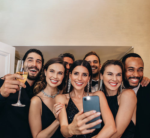 Multiracial group of socialites taking a selfie